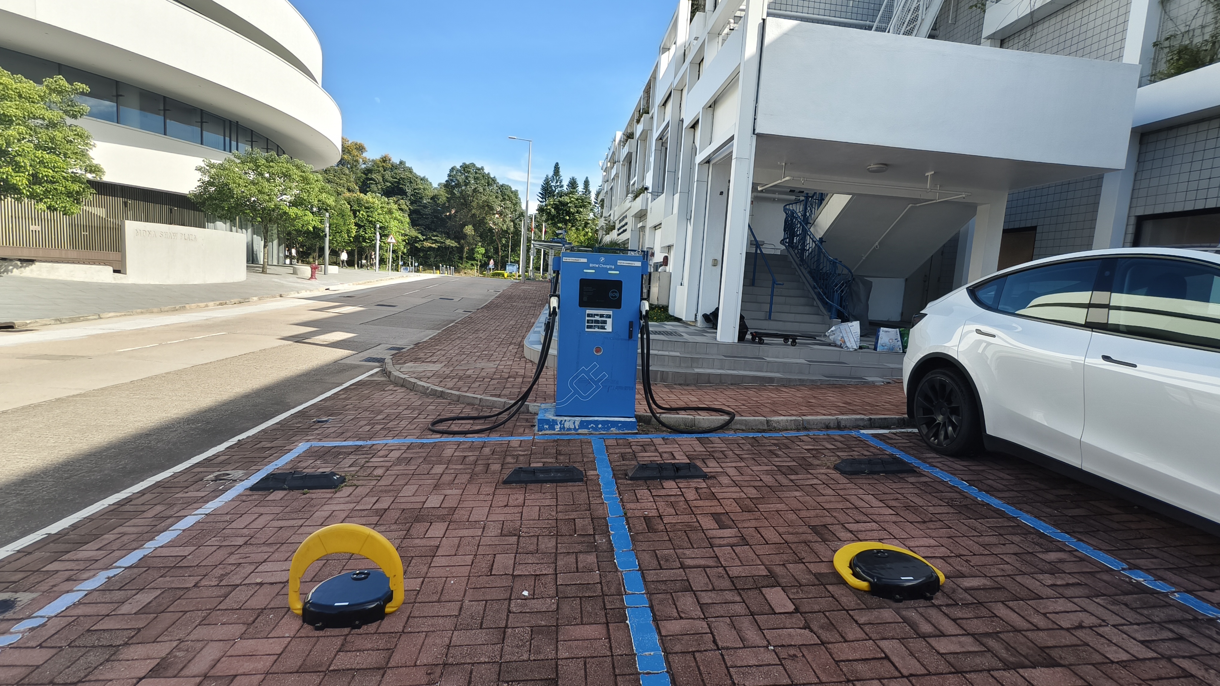EV Charger: HKUST EV-charging bays equipped with ground locks, supporting reservation-based parking access and charging management.